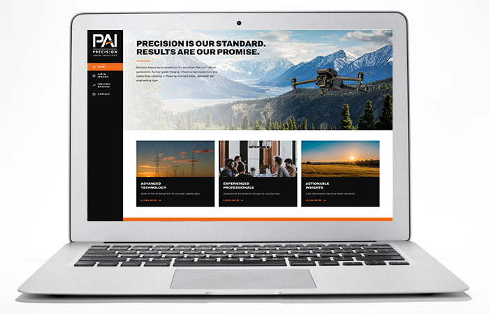 PAIMontana.com, the Precision Aerial Industries website, shown on a laptop